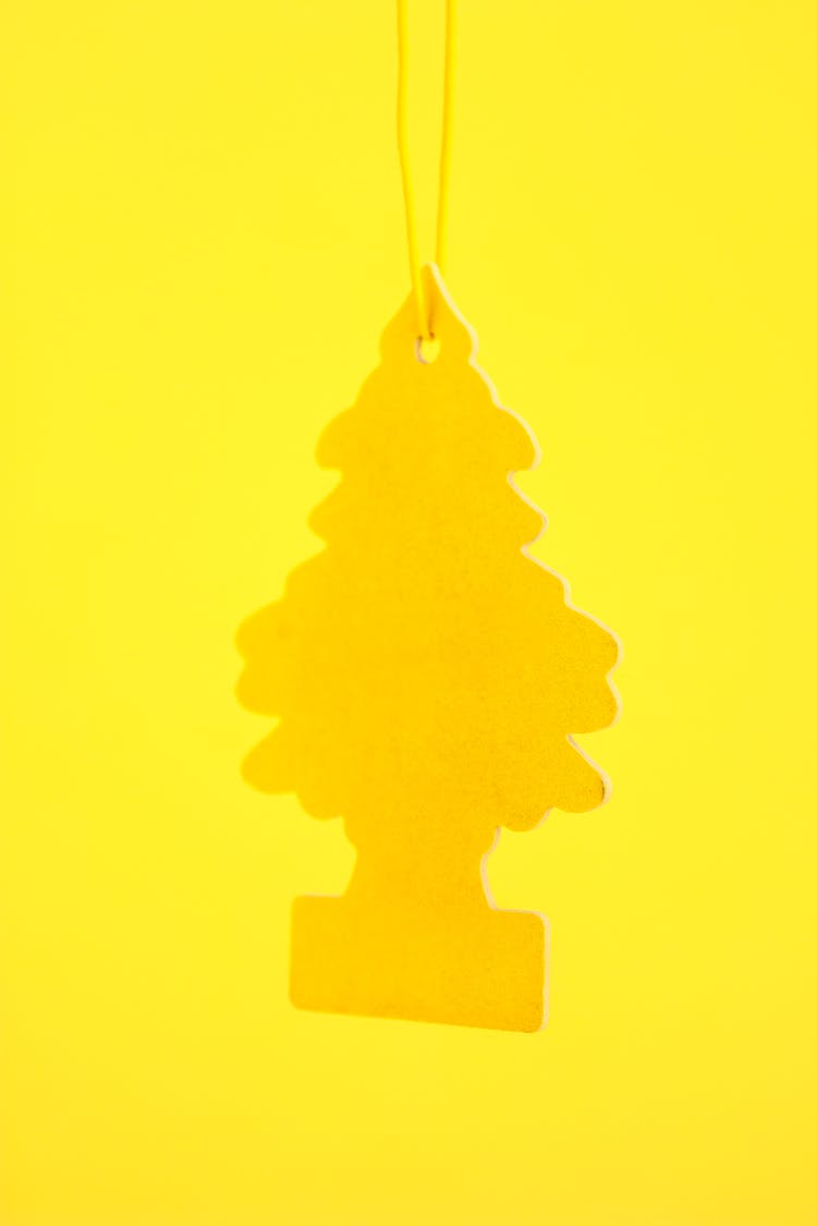 Close-up Of A Yellow Wunderbaum Car Fragrance 