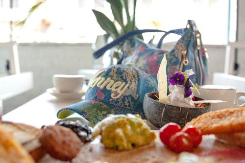 Close-up of Food, a Cup and a Bag on a Table 