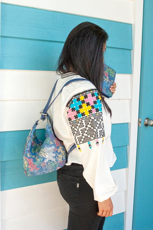 Young Woman Wearing a Patterned Jacket and a Backpack 