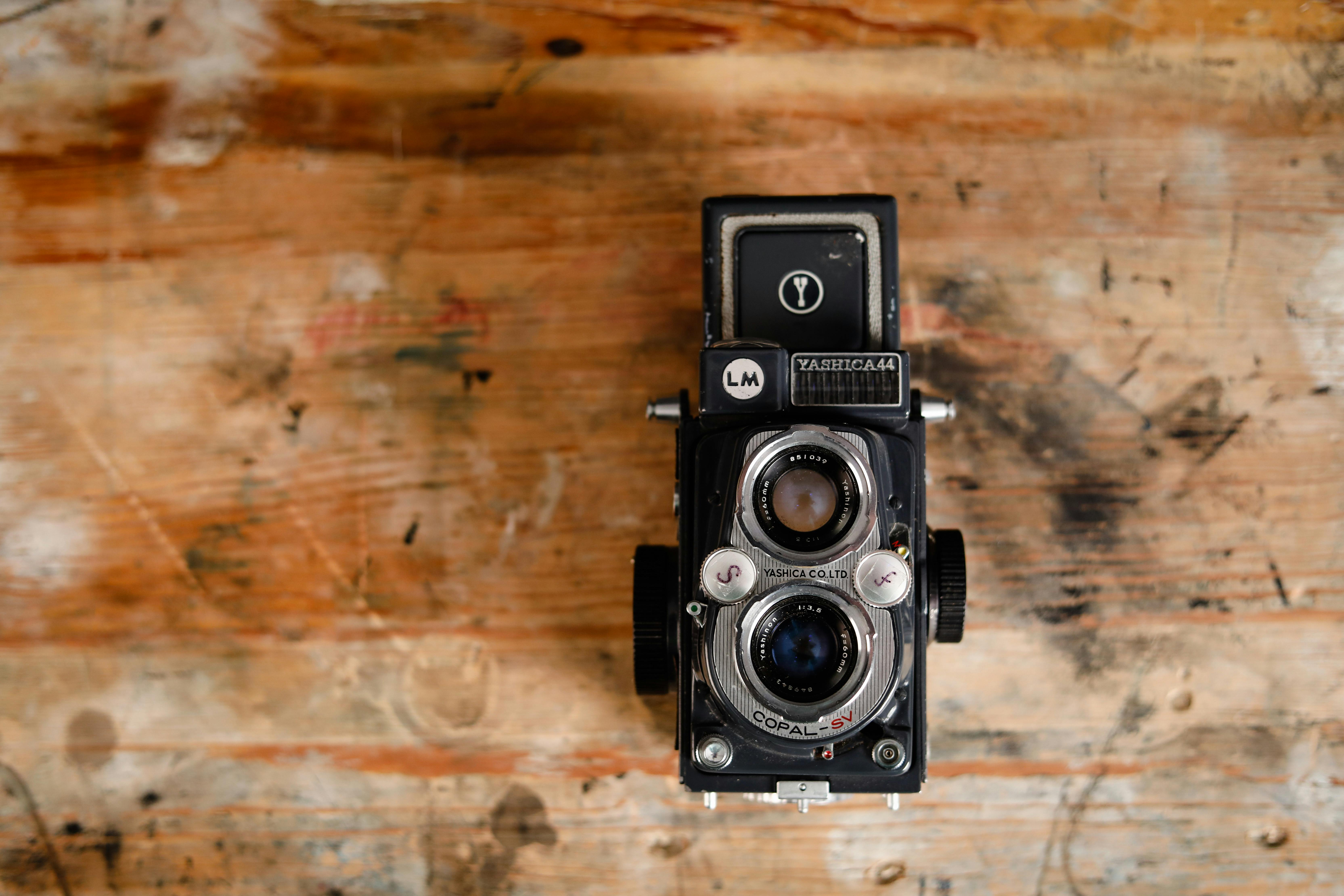 Vintage Camera Is Laying On Newspaper Background, News Without Picture  Background Image And Wallpaper for Free Download