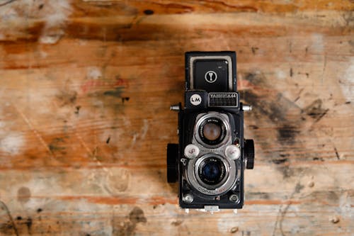 Free Black and Gray Land Camera on Brown Surface Stock Photo