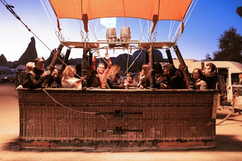 People Riding a Hot Air Balloon Carriage