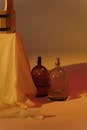 Clear Glass Bottle on Brown Wooden Table