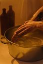 Person Holding Stainless Steel Cooking Pot
