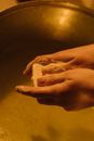 Persons Hand on Brown Wooden Table