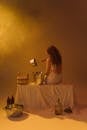 Woman in White Dress Sitting on Bed