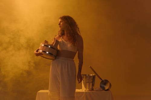 A Woman Holding a Water Bucket