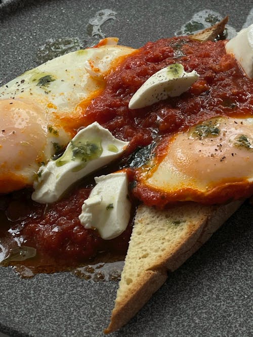 Free Close-Up Shot of Delicious Bread With Tomato Sauce and Egg Stock Photo
