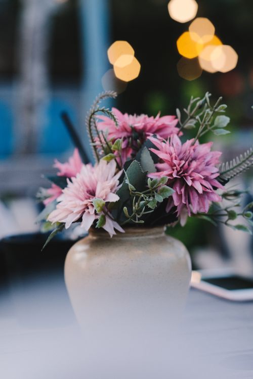 Free Stylish pink flower bouquet in a ceramic vase, perfect for decor inspiration. Stock Photo