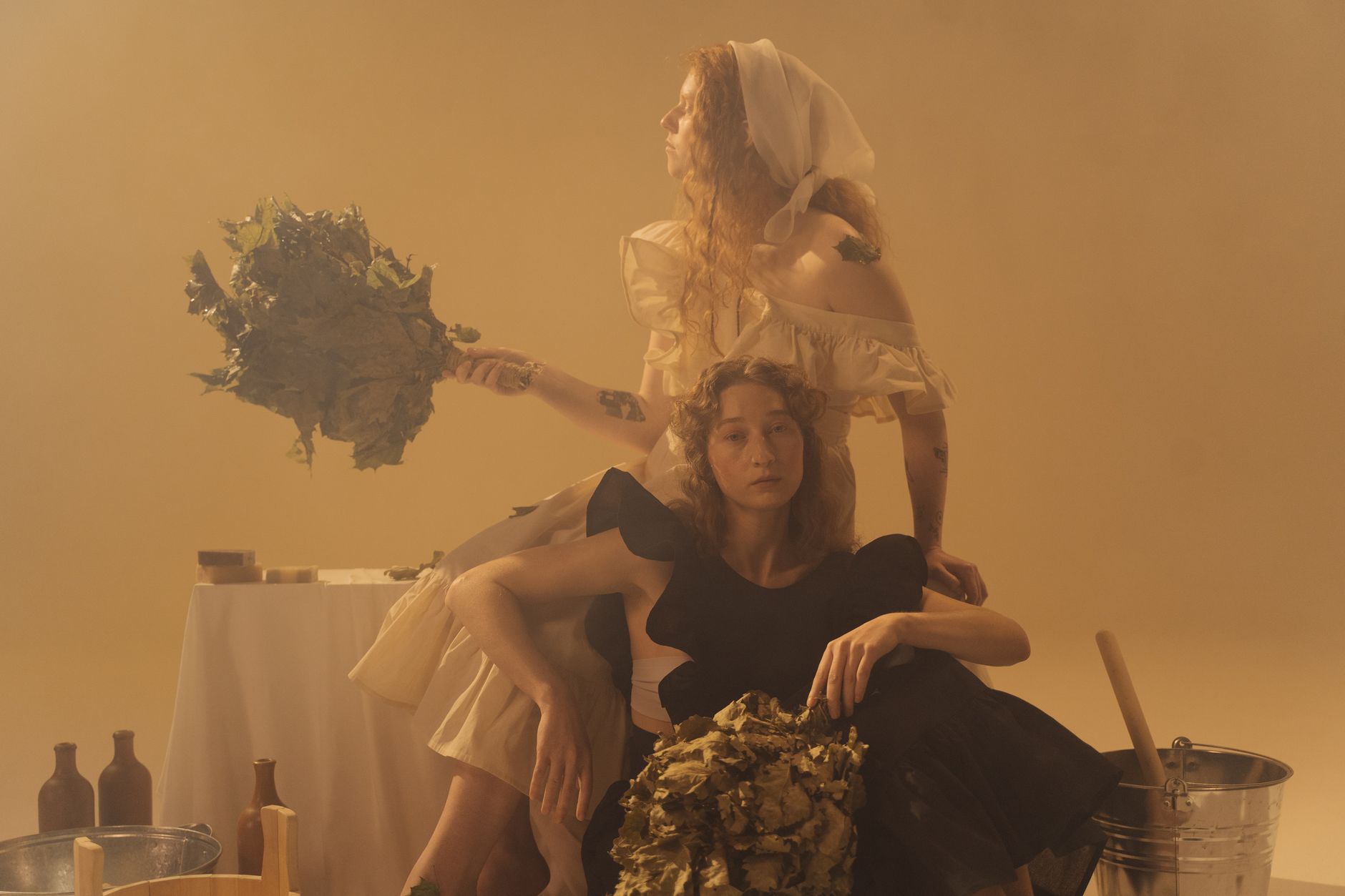 Two women enjoy a calming sauna experience, evoking wellness and tranquility.