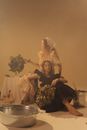 Woman in Black Dress Sitting on Chair