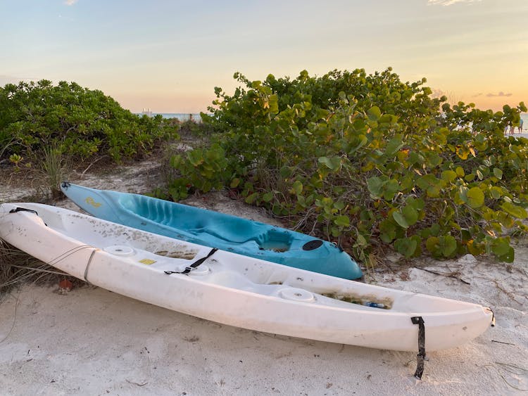 Old Unused Kayaks On Sand