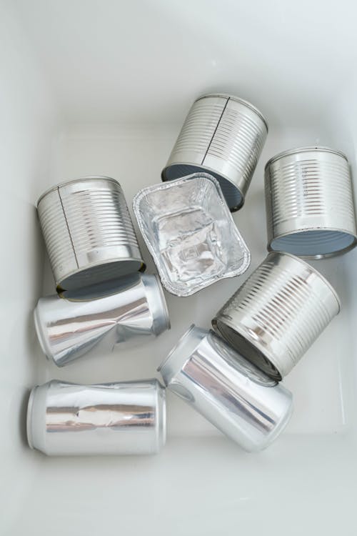 Free Silver Round Cans in the Table Stock Photo