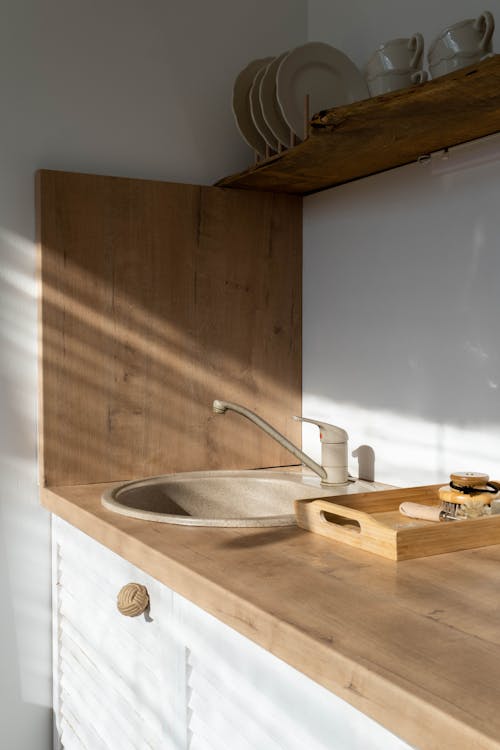 Brown Wooden Sink With Faucet in the Kitchen