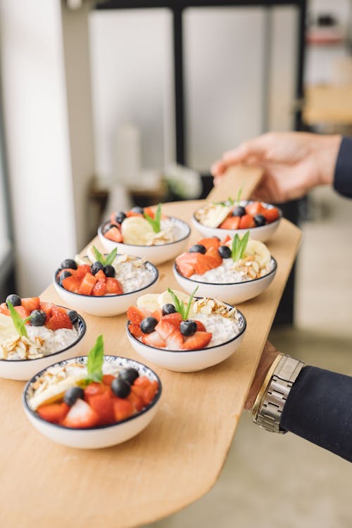 Bowls of Foods Served Over a Wooden Tray