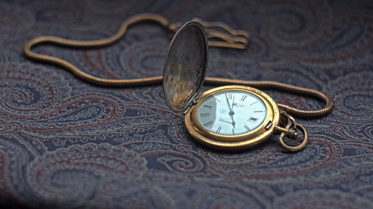 A Vintage Pocket Watch With Chain