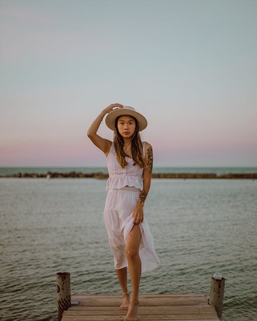 A Woman Posing by the Beach