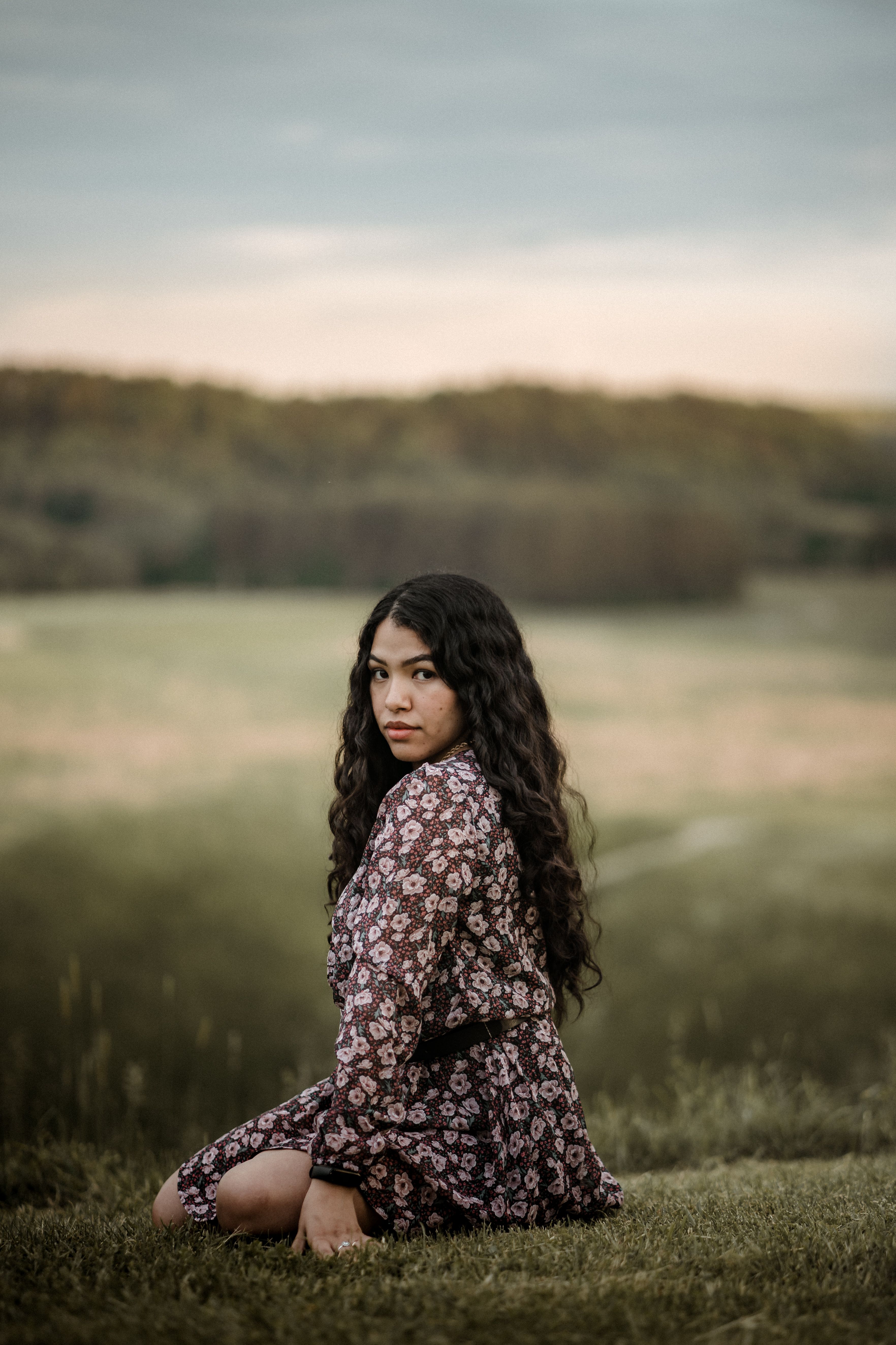 A Woman Sitting on the Grass · Free Stock Photo