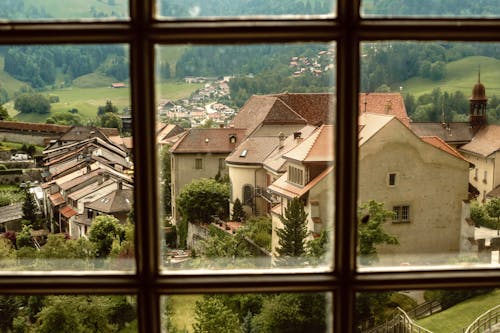 View of Old Houses in an Old Town Through Glass Window 