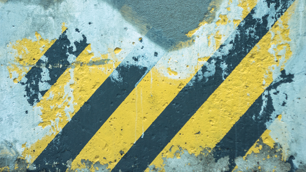 A Faded Striped Road Sign