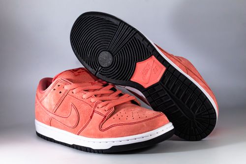 Free Close-up of vibrant coral sneakers with detailed sole pattern, perfect for fashion enthusiasts. Stock Photo