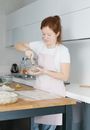 A Woman Using a Mortar and Pestle