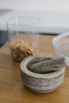 A versatile kitchen tool, this marble mortar and pestle set is perfect for grinding spices with style.