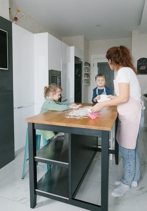 Free kids Baking with Their Mother Stock Photo