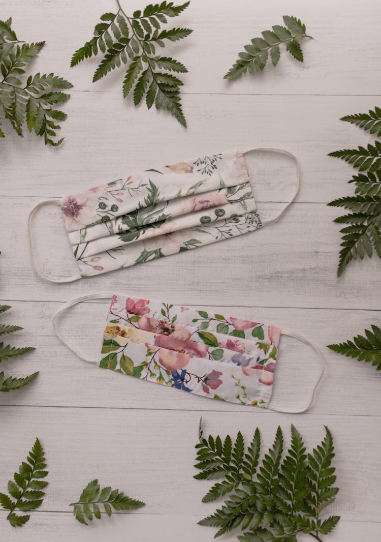  Floral Print Face Masks On White Surface 