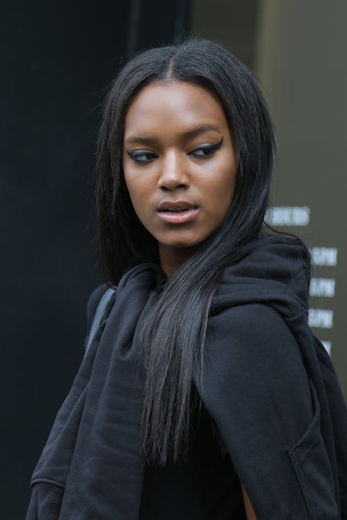 Portrait of a Beautiful Woman Wearing a Black Hoodie Jacket