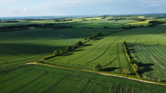 Aerial view of UK farmland representing the agricultural and business property relief landscape under the April 2026 reform