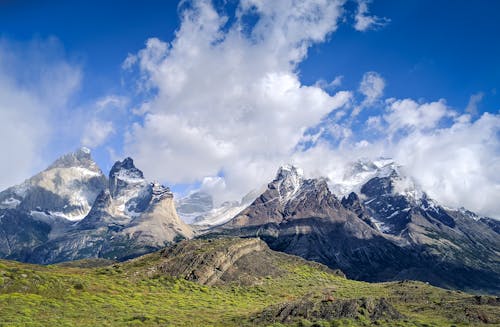 Snow Covered Mountains Under White Clouds