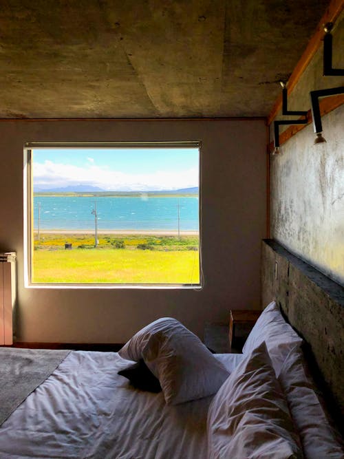 A Bedroom with a View of a Blue River