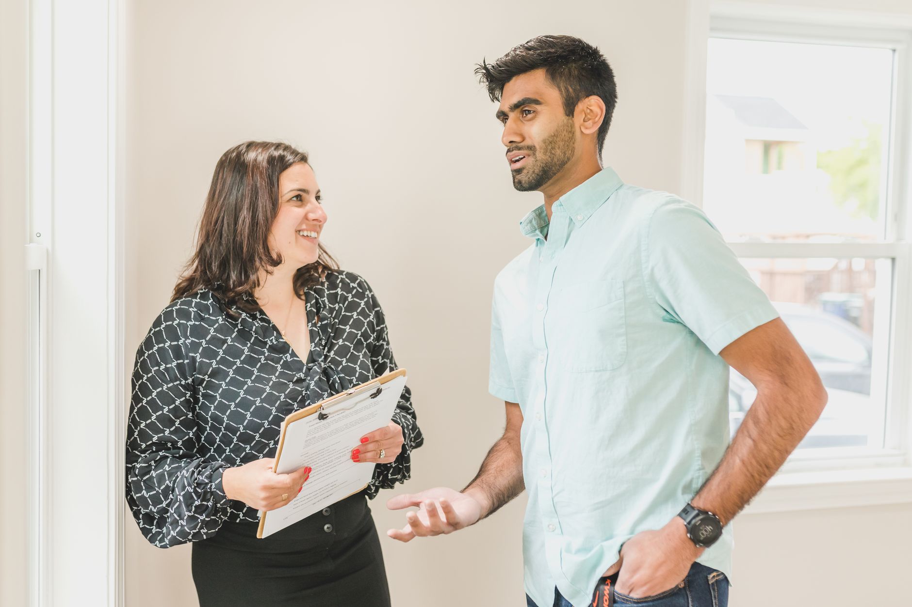 Elevate Operations with a Digital Billing Solution 7 Professional showing a client how to use modern cloud software on a tablet, illustrating ease of use