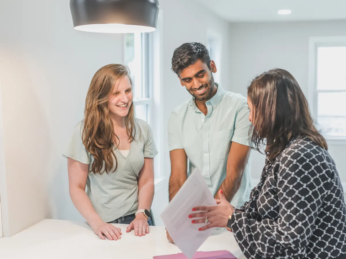 A diverse group of people working in a modern office space, symbolizing collaboration and innovation. Alt text: Innovative real estate solutions through collaborative efforts.