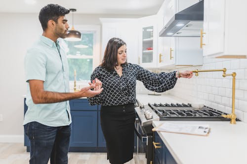 Free A Real Estate Agent Giving a House Tour Stock Photo