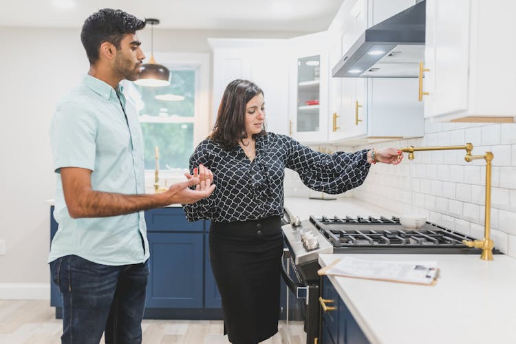 A Real Estate Agent Giving A House Tour