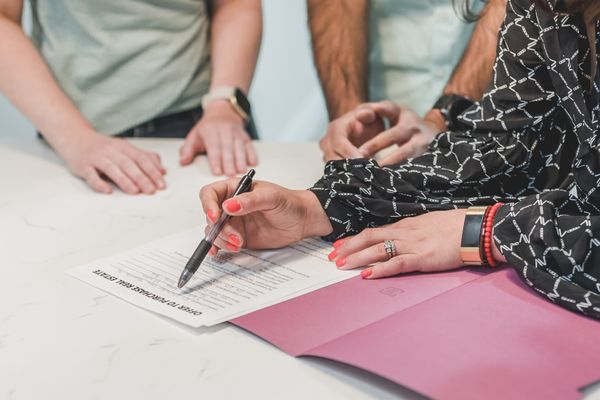 Signing real estate closing documents at a title company