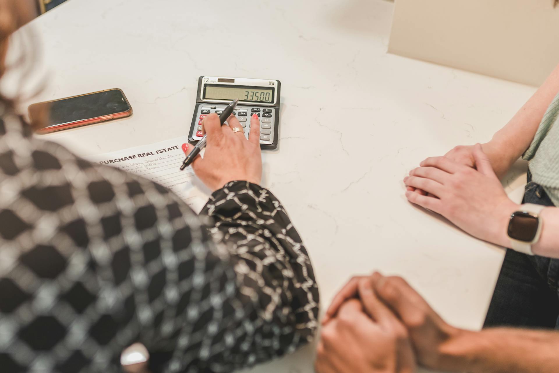 A Real Estate Agent Using a Calculator