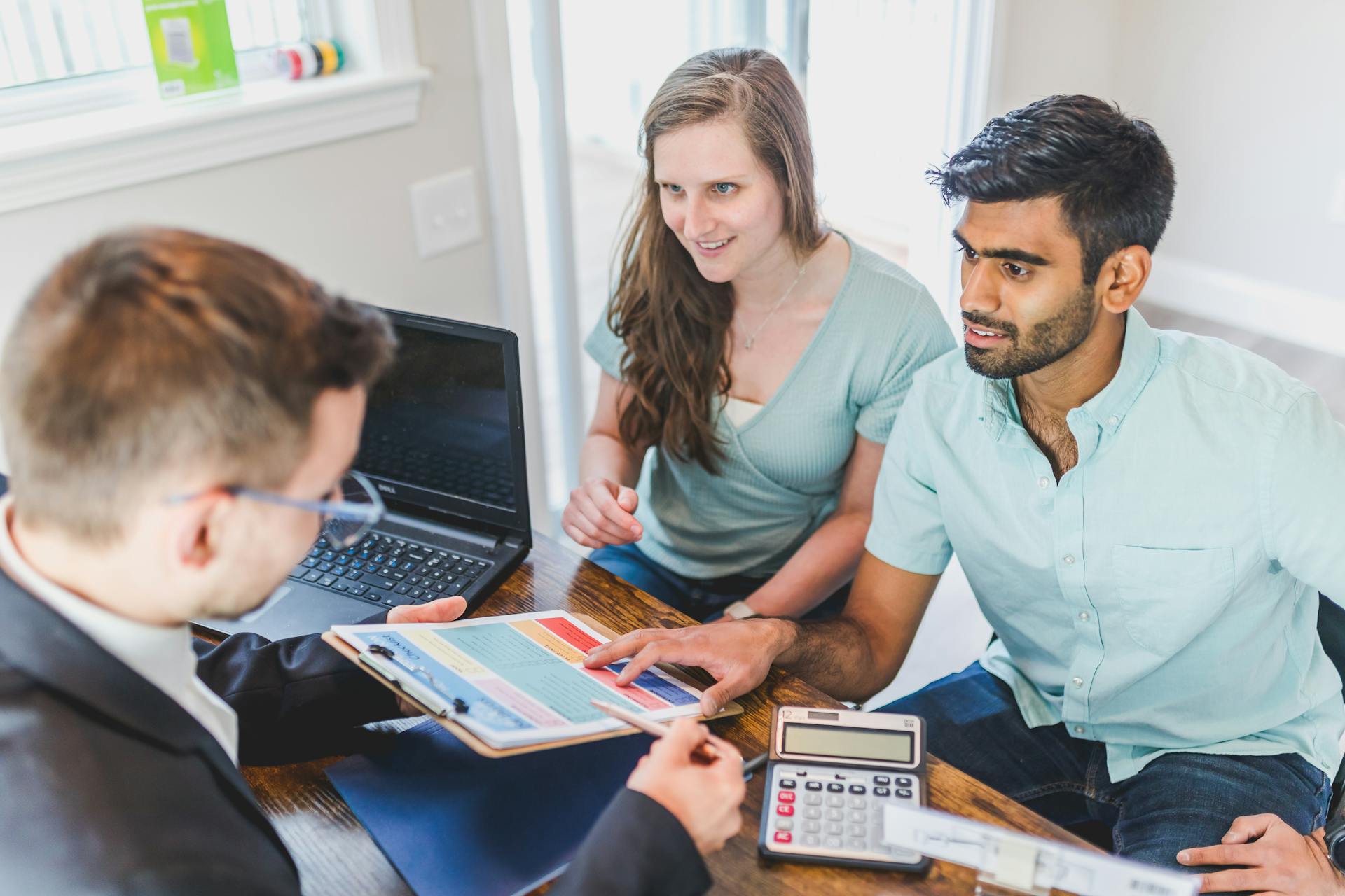 A Couple Talking to the Real Estate Agent