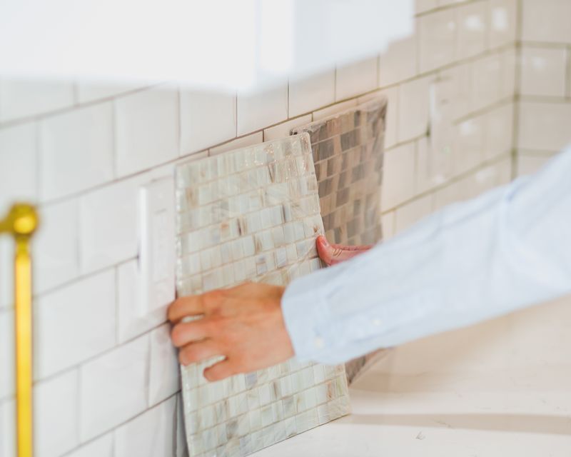 Tradesman carrying out construction and tiling work