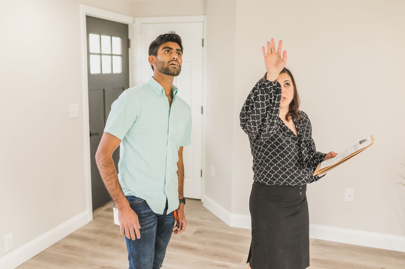 Real estate professional discussing a property with a client
