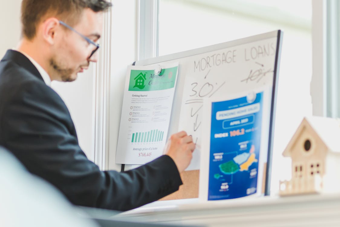 A person writing on a whiteboard