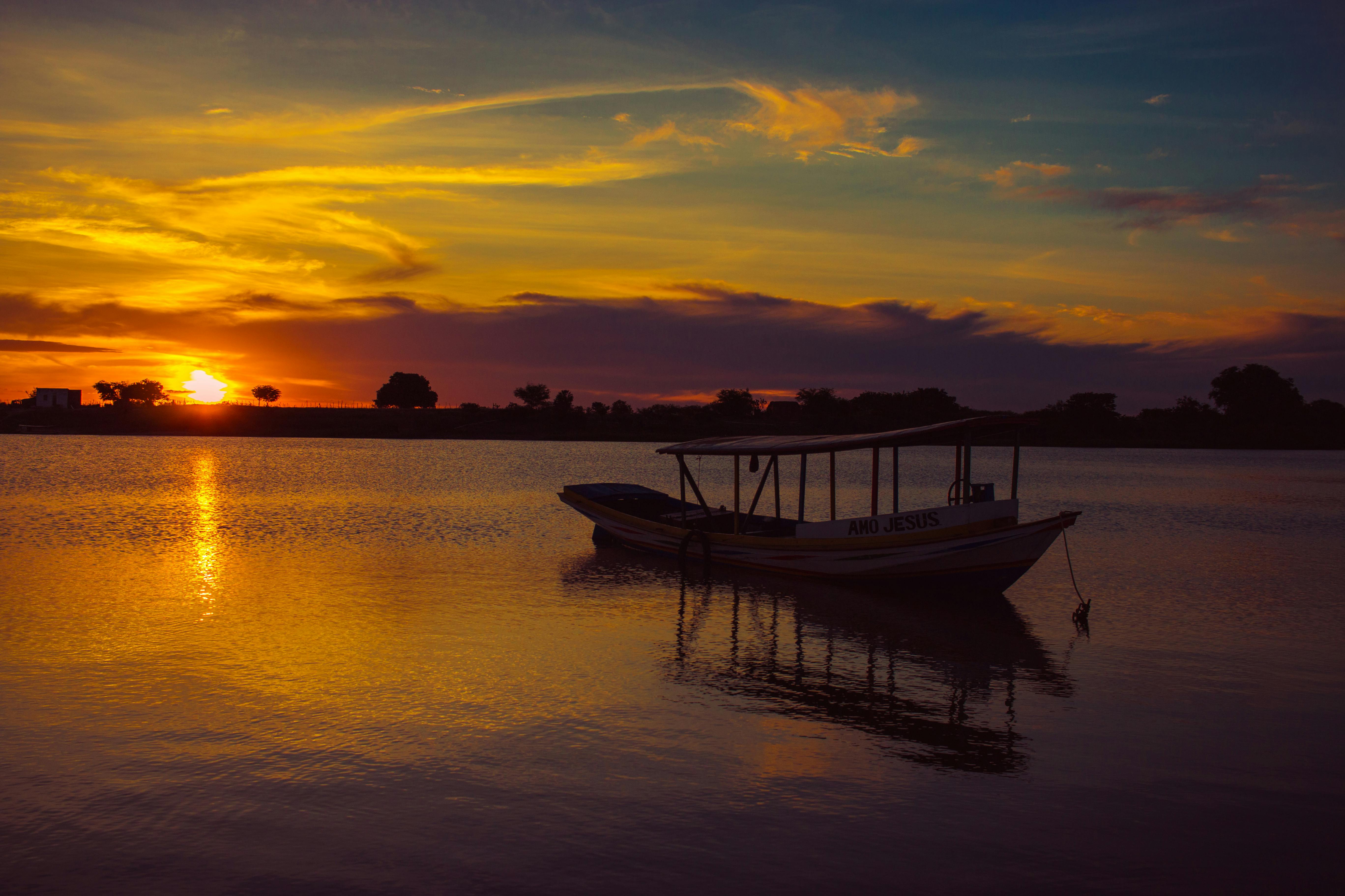 Wooden Old Fishing Boat On River At Sunset Photo Background And