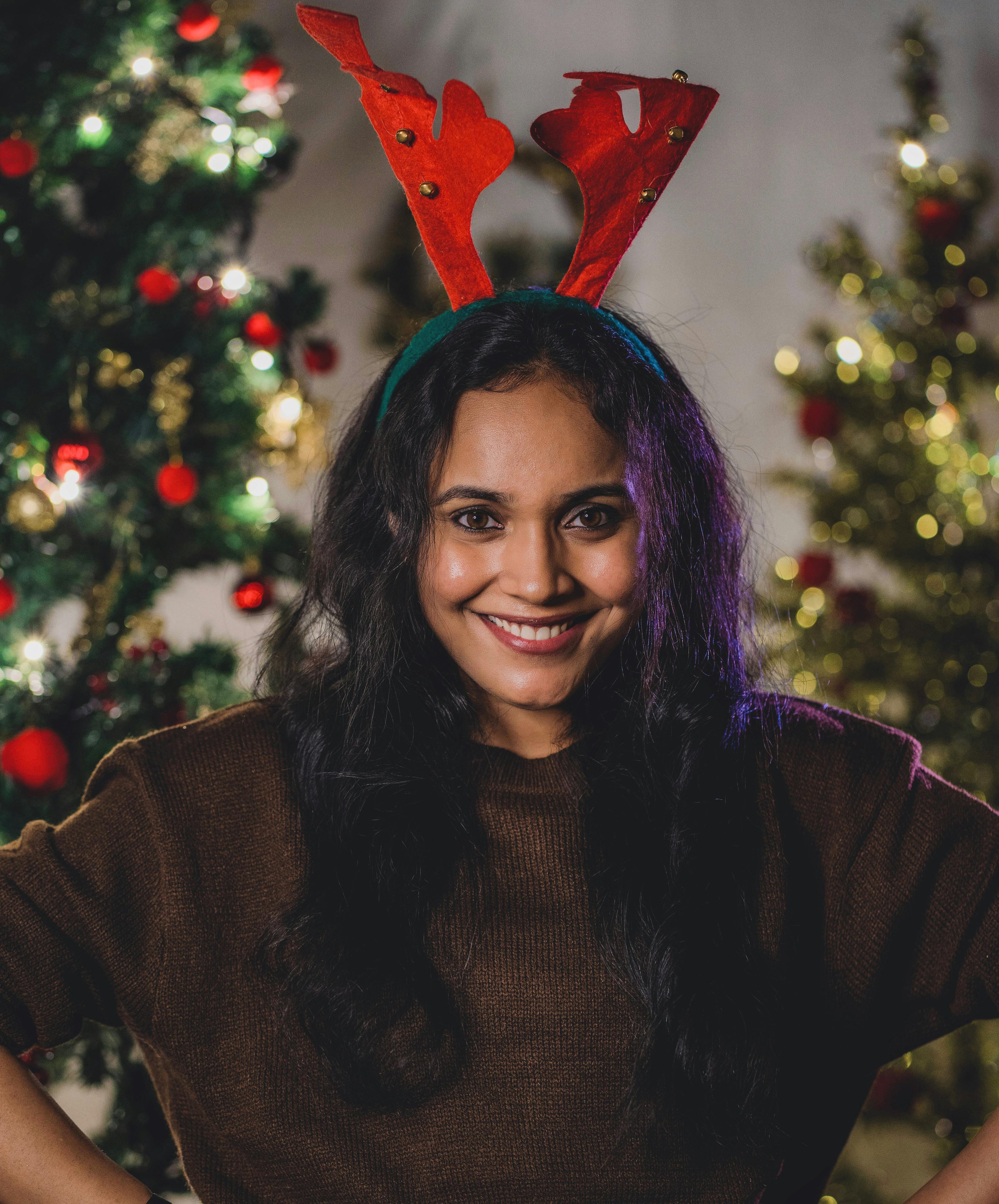Woman in Brown Sweater Smiling