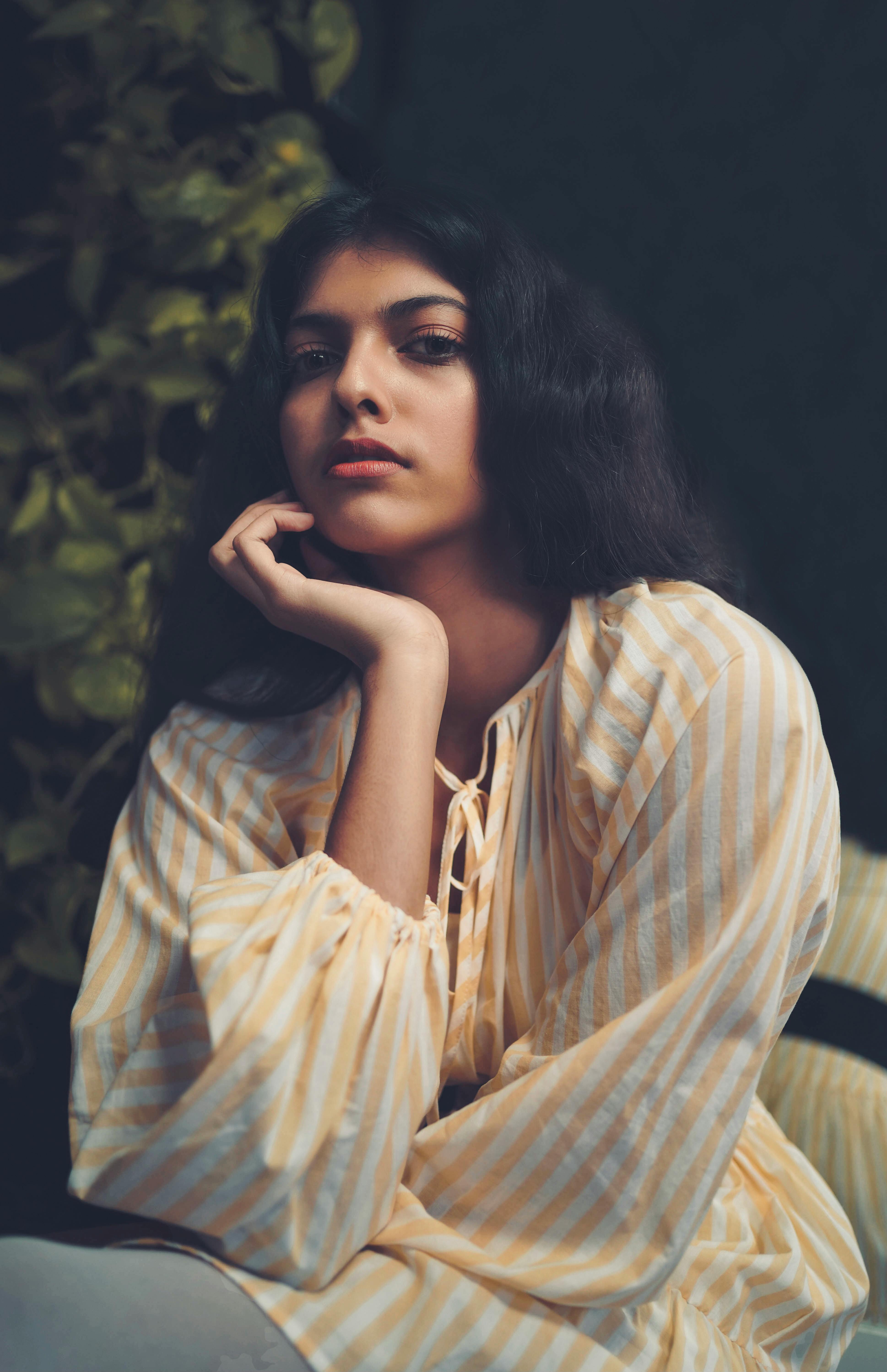 Woman in White and Yellow Stripe Dress