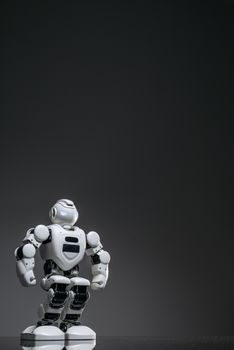 Stylish robot against a dark backdrop, showcasing futuristic technology.