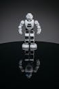 A White Robot on a Black Shiny Surface