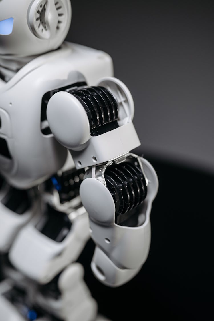 A White And Black Arm Of A Robot Toy