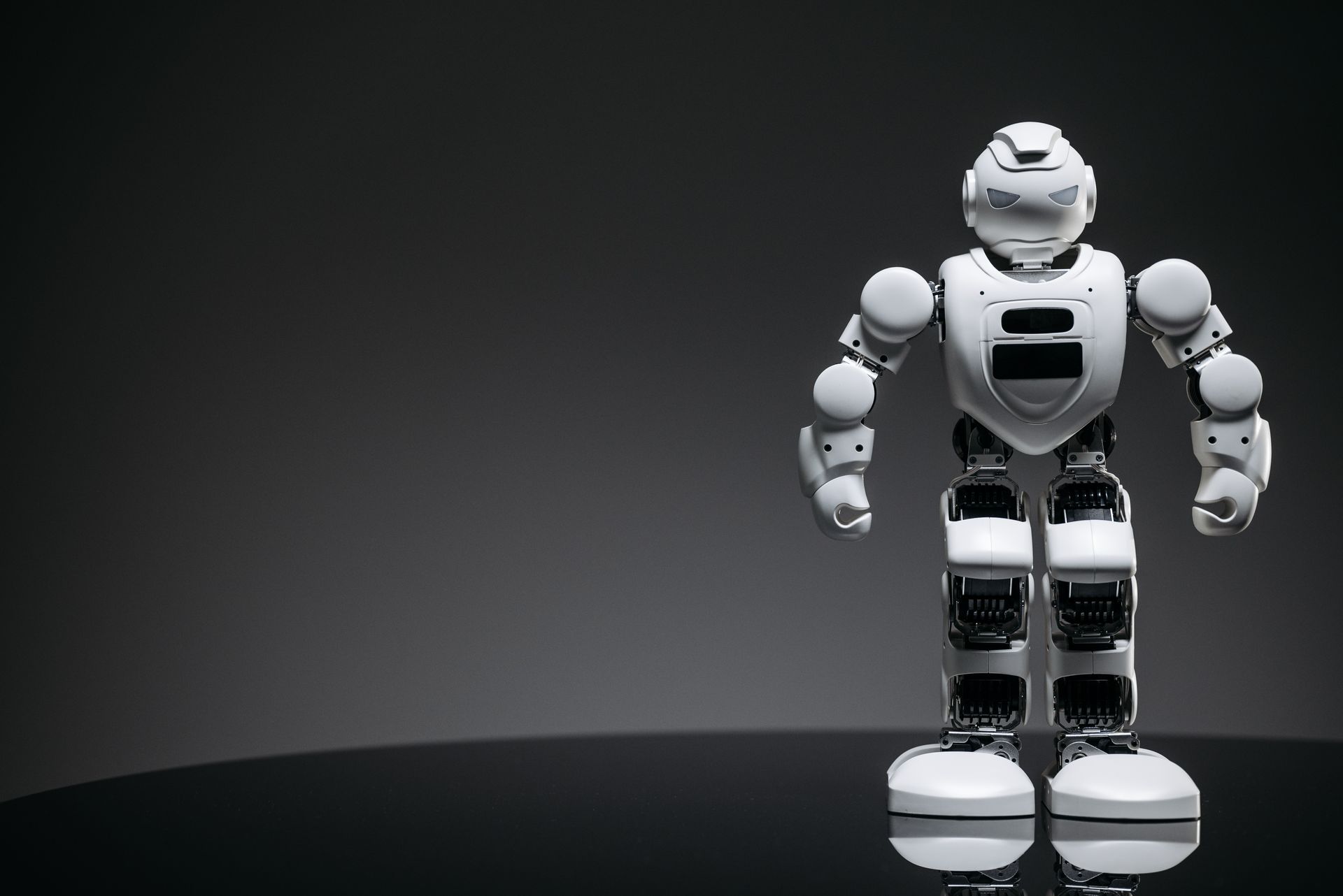 A Close-up Shot of a White Robot Toy